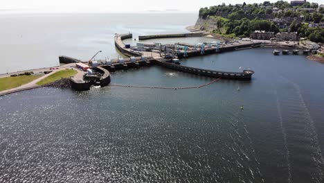 aerial forward shot of cardiff bay barrage and penarth head on a sunny day