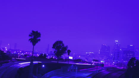 Excellent-shot-of-heavy-traffic-driving-on-a-busy-freeway-in-Los-Angeles-at-night