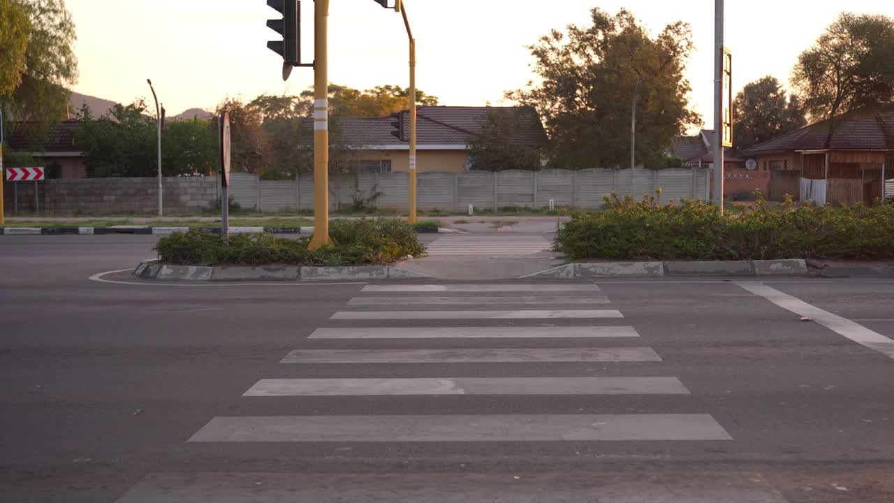 4K SHOT OF PEDESTRIAN ZEBRA CROSSING IN EVENING LIGHT - GABORONE BOTSWANA