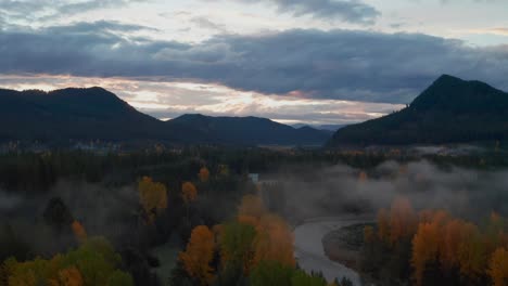 breathtaking morning scenery in washington state, with mystical fog along the river and colorful forest