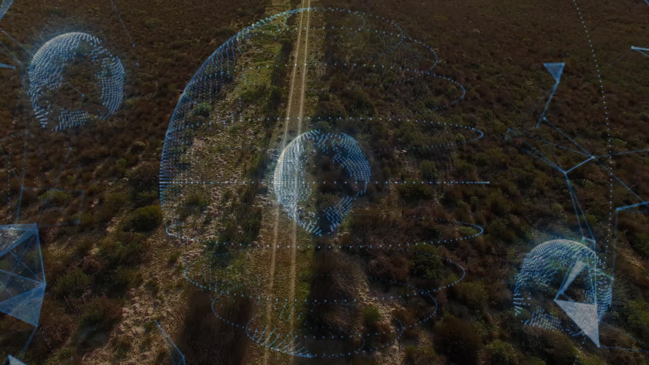 Holographic globe hovering over scrubland, projecting dotted spheres, rings and node connections