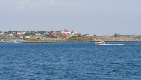 luxury speed boat driving on ocean at northern archipelago in gothenburg, sweden