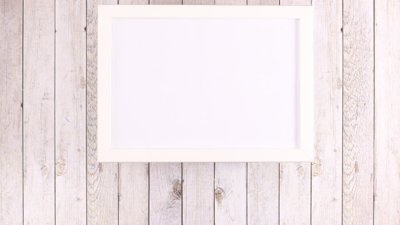 White frame with place for text and fruits and vegetables appear under frame. Stop motion