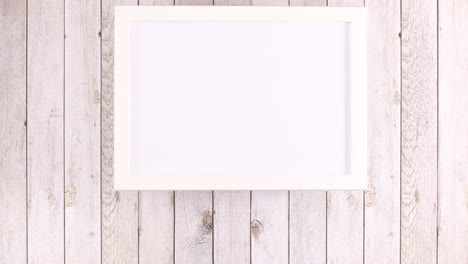 white frame with place for text and fruits and vegetables appear under frame. stop motion