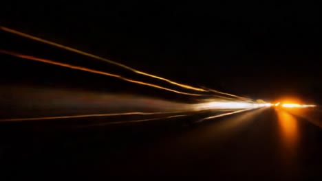 dynamic light trails and motion effects captured at night on a busy road showcasing the speed and energy of modern transportation