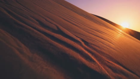 sunset over a desert sand dune