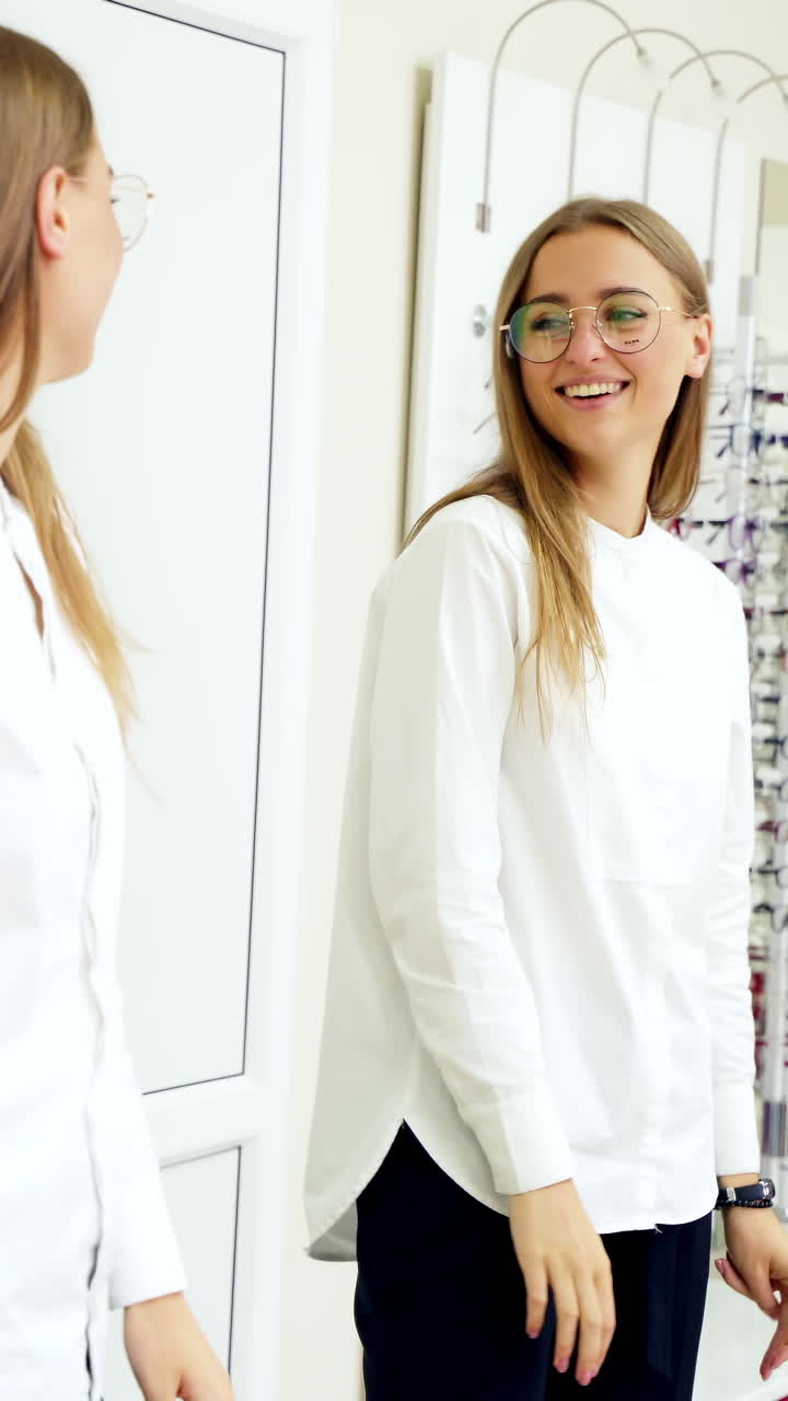 Woman shopping for eyeglasses. Pretty girl trying eyeglasses at store
