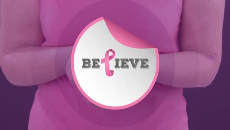 Video-of-breast-cancer-awareness-text-over-caucasian-woman-holding-pink-cancer-awareness-ribbon