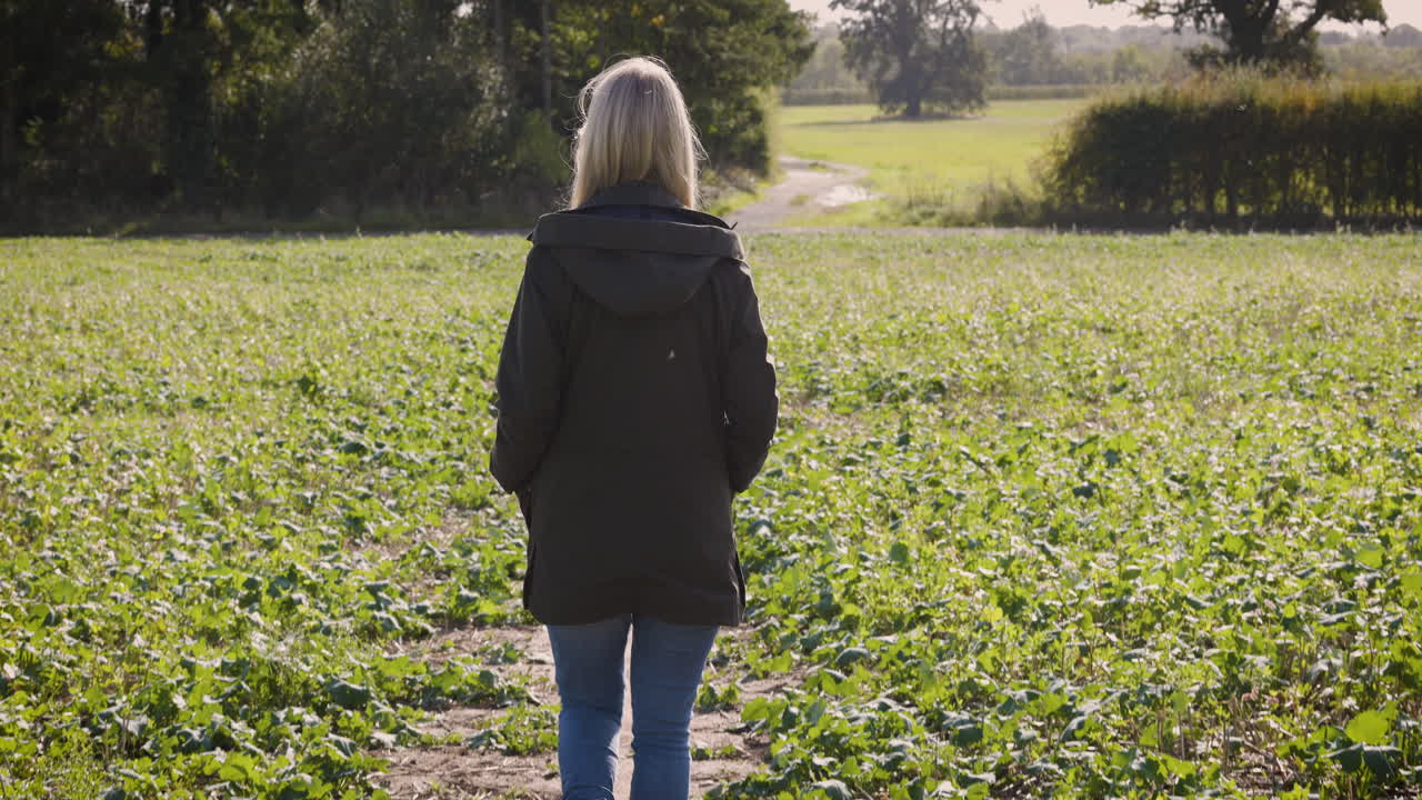 Woman walking in a rural field