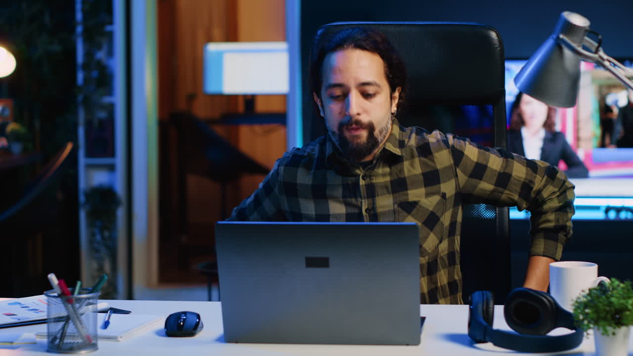 Remote employee arriving in stylish apartment office, starting job