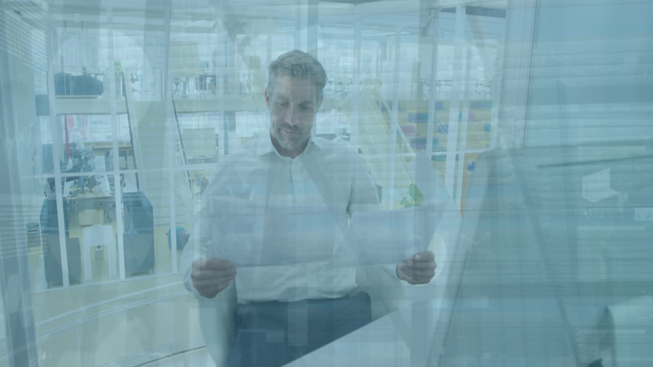 Animation of financial data processing over caucasian businessman in office