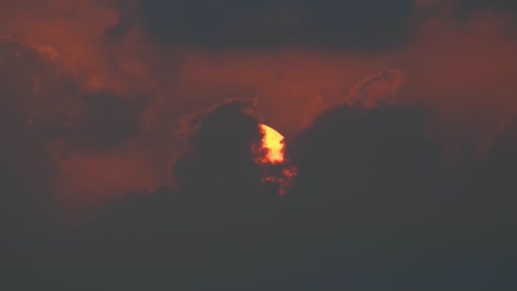 Sunrise-time-lapse-early-hours-big-sun-up-close-reveal-behind-clouds