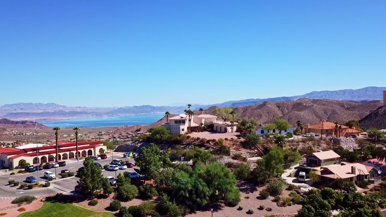 Drone going up in Boulder City Nevada revealing Lake Mead in the background