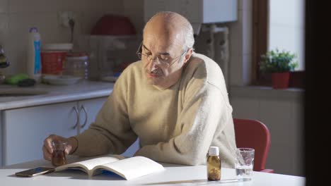 The-old-man-is-at-home-alone-reading-a-book-and-drinking-his-tea.