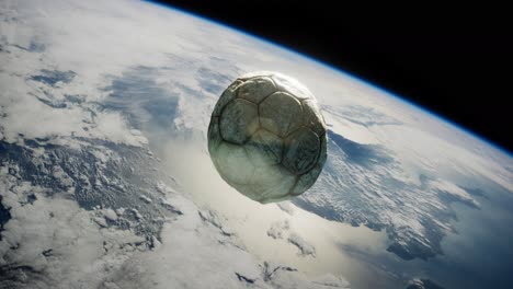 old soccer ball in space on earth orbit