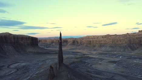 sharp rock formations in mountainous valley under sunset sky