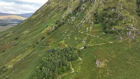 4K-Aerial-shot-of-path-leading-up-to-Ben-Nevis,-above-Glen-Nevis,-Fort-William