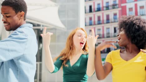 diverse group of friends dancing happily in the city