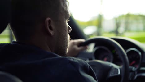 man driving a car