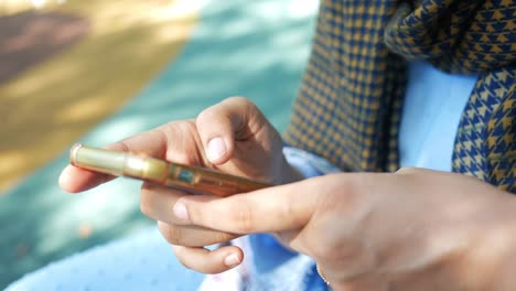 Close-up-of-women-hand-holding-smart-phone