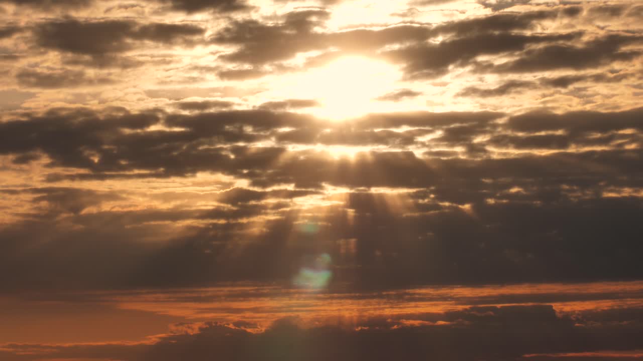 Amazing dramatic sunset behind rain clouds