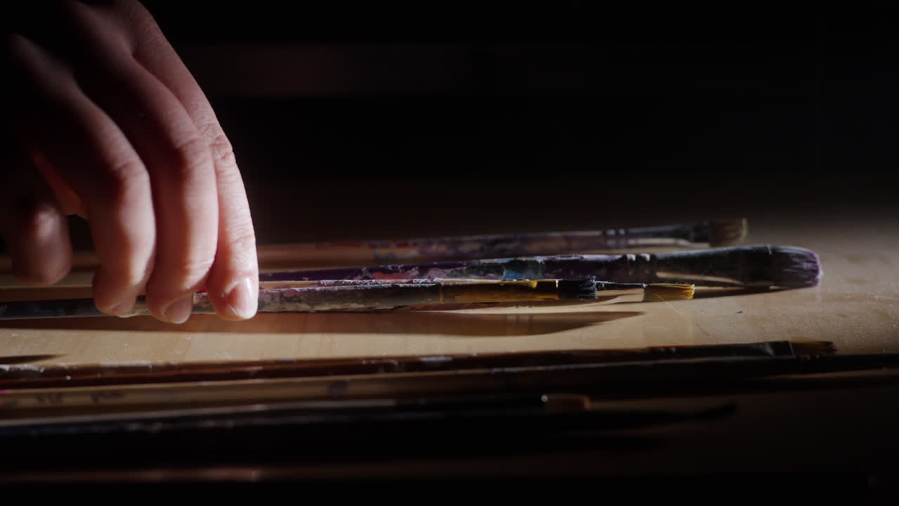 Used Paintbrushes on a Palette