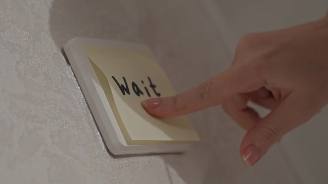 Close up view of hand interacting with various light. White rectangular switch is pressed. Another scene shows hands approaching and removing same post it from another wall