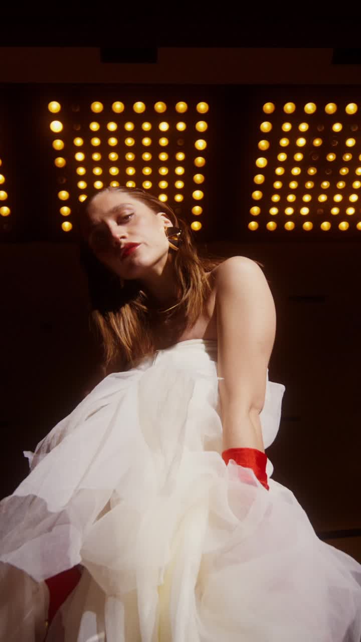 Woman in White Dress with Red Gloves