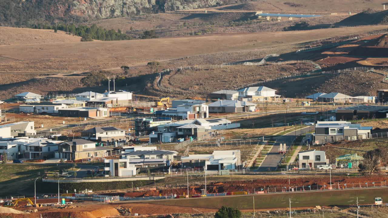 Rows of outlined plots await future construction in Canberra, showing planned residential growth from above