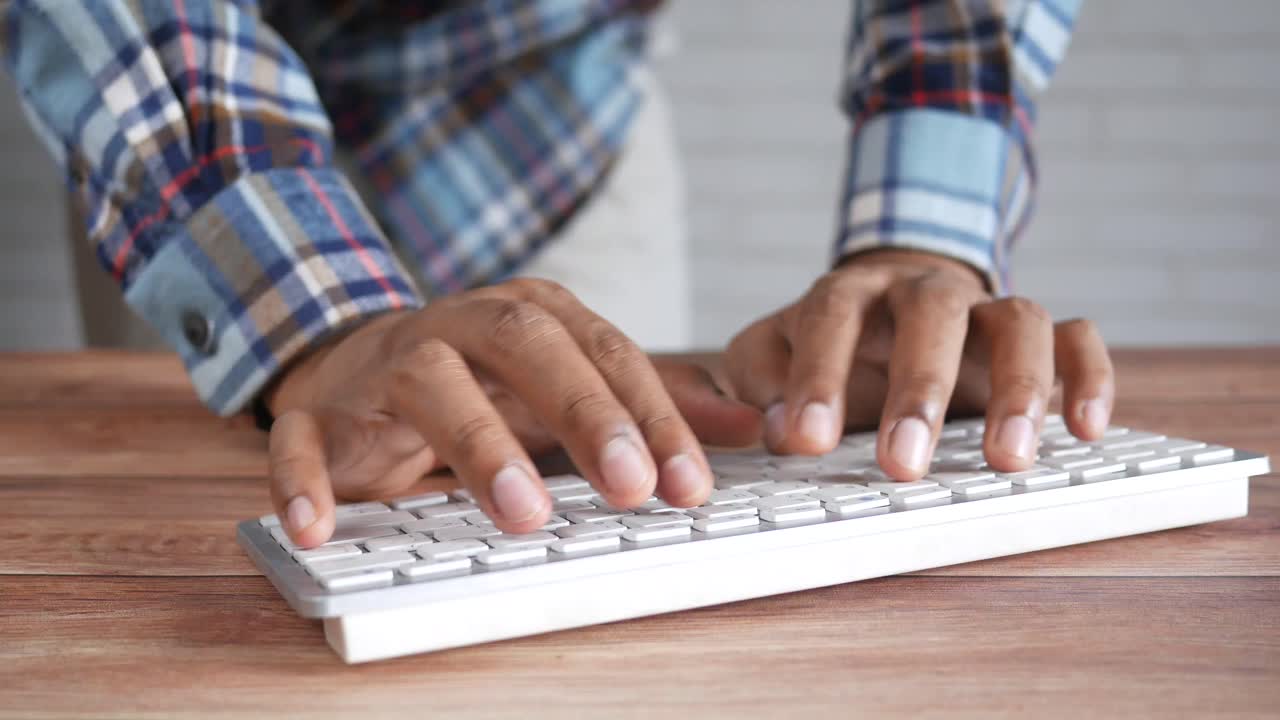Person Typing on a Keyboard