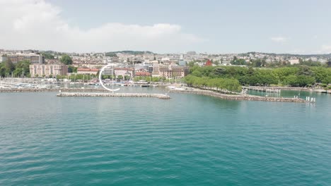 drone flying away from beautiful yacht harbor in lausanne, switzerland