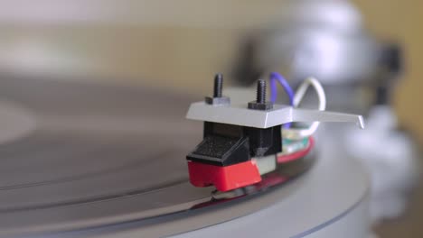 turning on a vintage turntable - macro shot