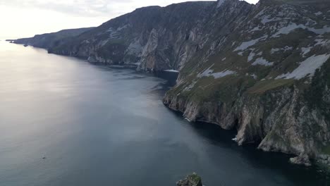 drone video revealing slieve league, ireland at sunset