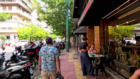 people walking and interacting on a busy street