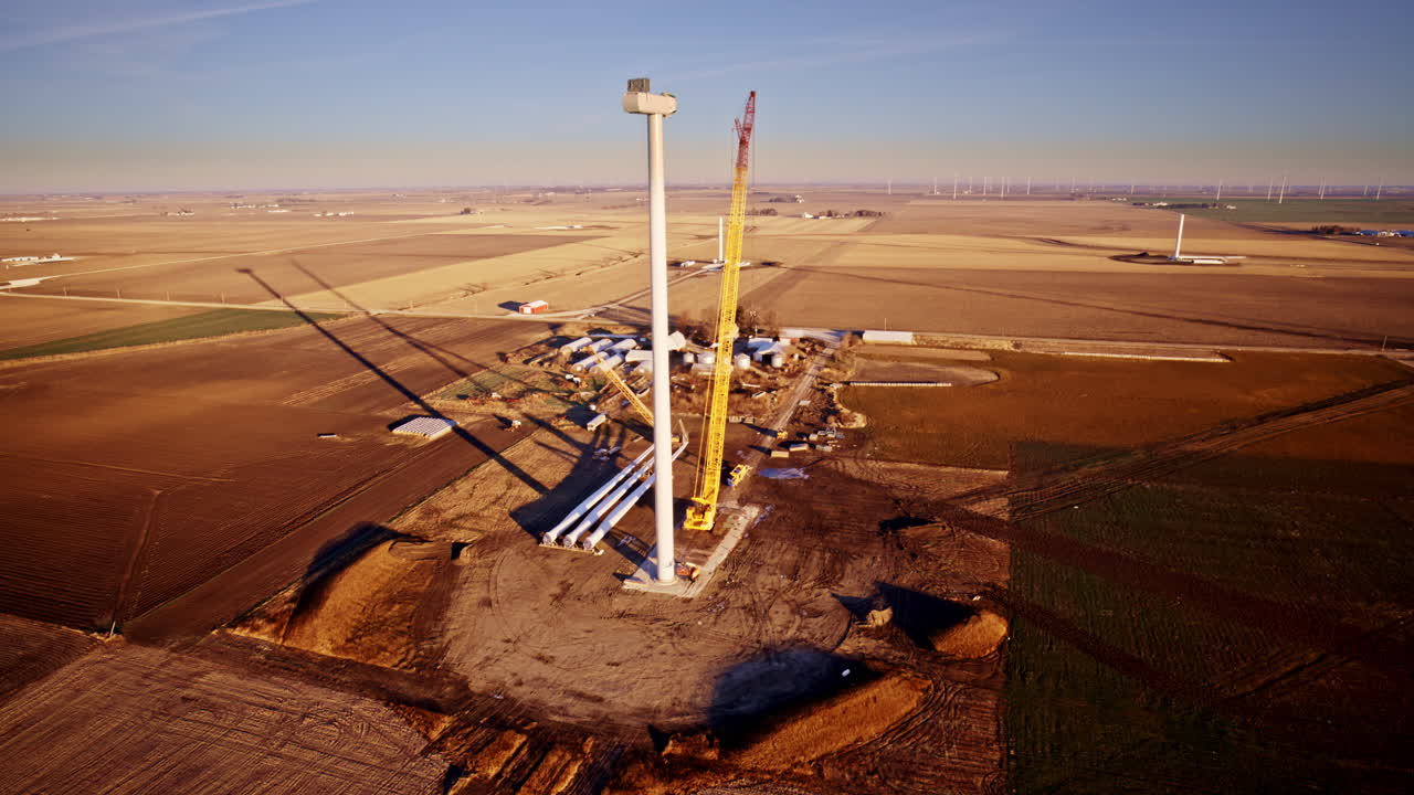 Aerial view of wind turbine construction across Illinois plains