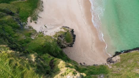 Birds-eye-view-drone-shot-revealing-the-sheer-cliffs-at-Traigh-Mhor-beach-in-Tolsta-village-on-the-Outer-Hebrides-of-Scotland