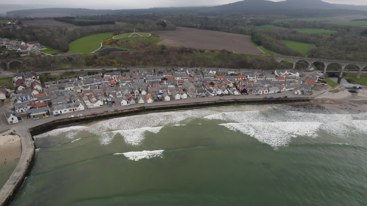 Aerial views of scottish small town of Cullen with beach and viaduct