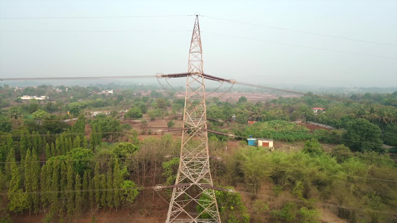 electric Transmission tower drone moving to closer view in village Maharashtra India