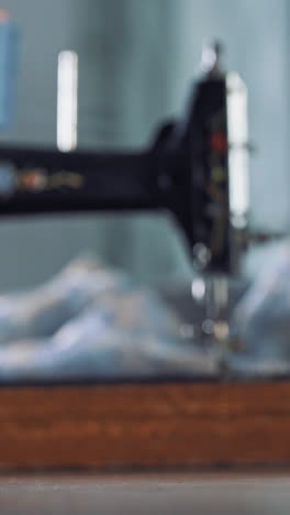 measurement line on table. close up view of woman hand rolled up measuring tape vertical video