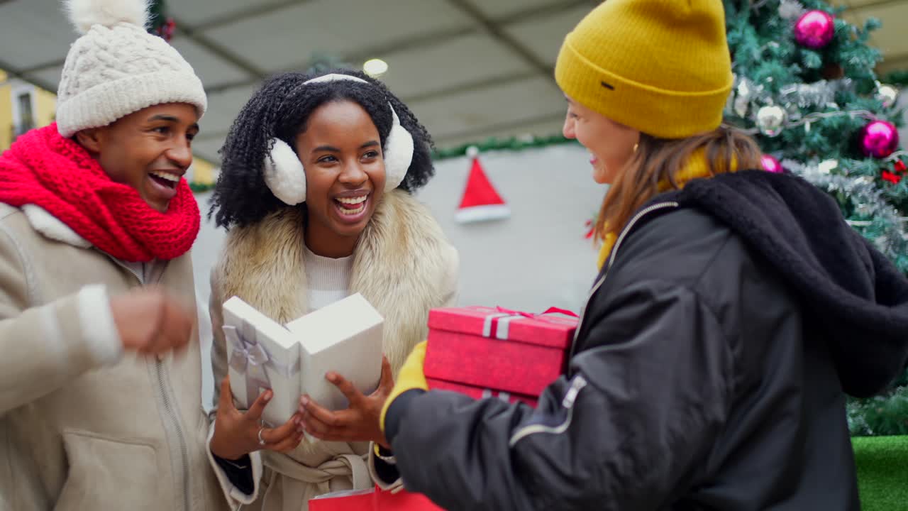 Friends Exchanging Christmas Gifts
