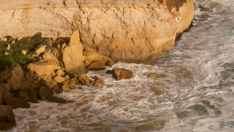 ocean waves hitting rocks at port campbell