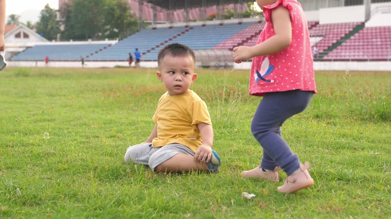 A Toddler Kid Helps To Get Up