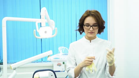 dentist putting on gloves