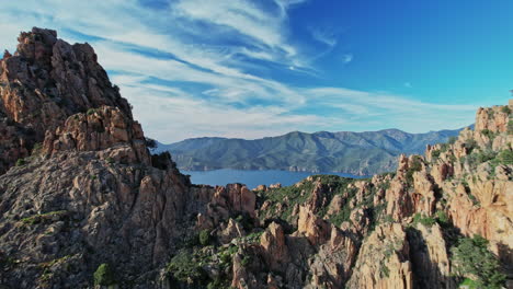 majestic mountain range and distant lake in corsica, france