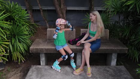 mother and daughter getting ready to roller skate