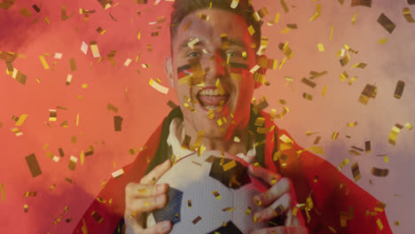 Animation-of-gold-confetti-over-cheering-caucasian-male-football-fan-with-flag-of-germany-face-paint