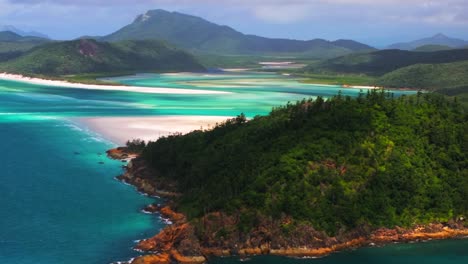 whitsundays islands whitehaven beach north end hill inlet lookout aerial drone picturesque sandy national park scenic flight view sunny clouds moving summer  clear blue waters parallax upwards motion