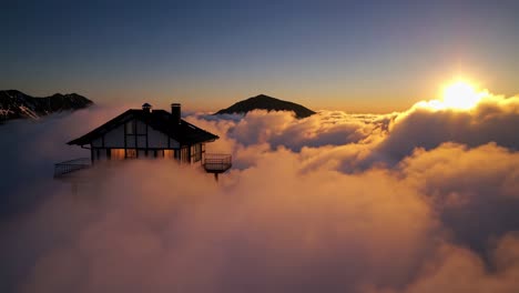 cabin above the clouds at sunrise