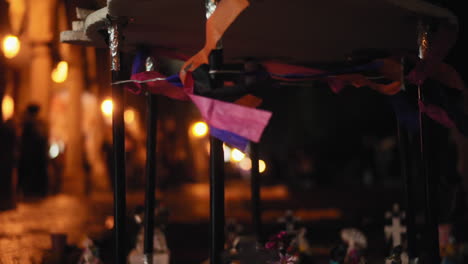 close-up-of-an-altar-of-the-dead-on-a-night-with-lightning-during-the-celebration-of-the-Day-of-the-Dead-in-Mexico-with-skulls