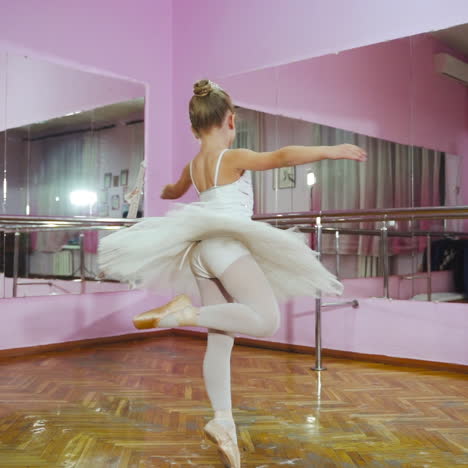graceful girl practicing ballet in the studio. ballerina. slow motion